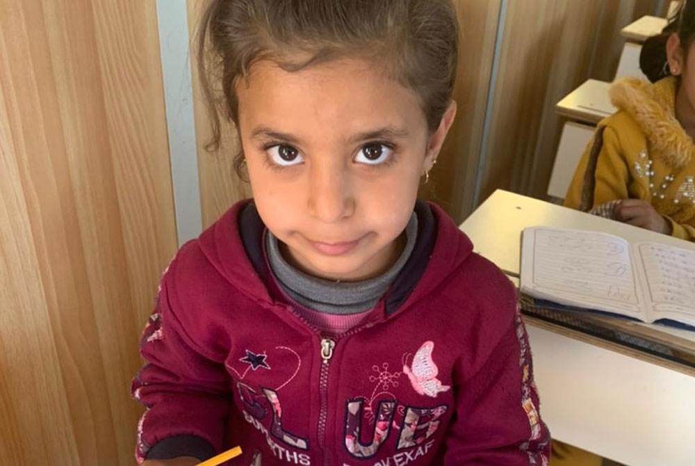 Refugees in Jordan - Clara is learning write and read
